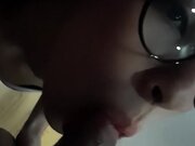 Bombshell woman with glasses takes a fast facial cumshot